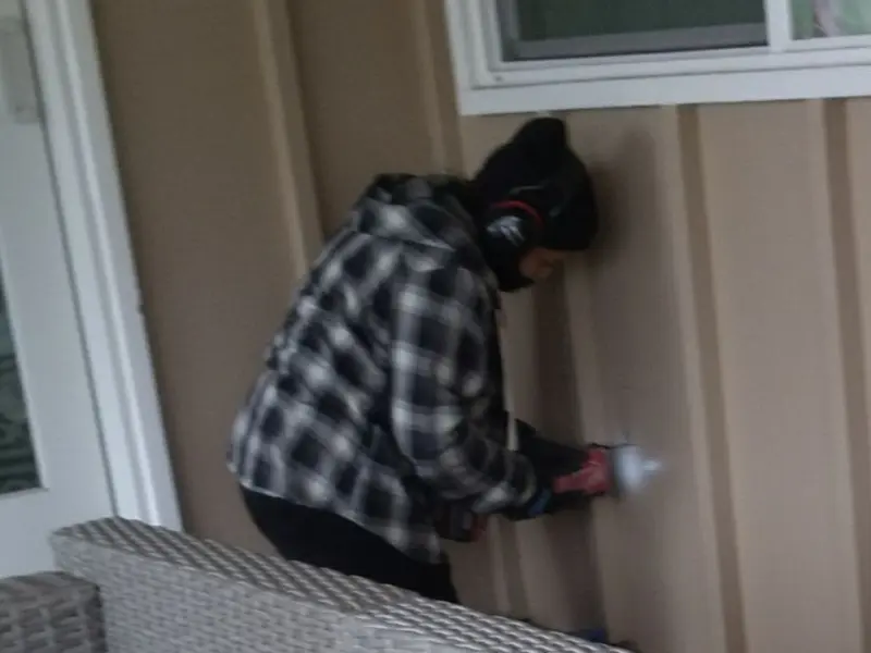 Professional electrician installing an exterior outlet in Bridgeport